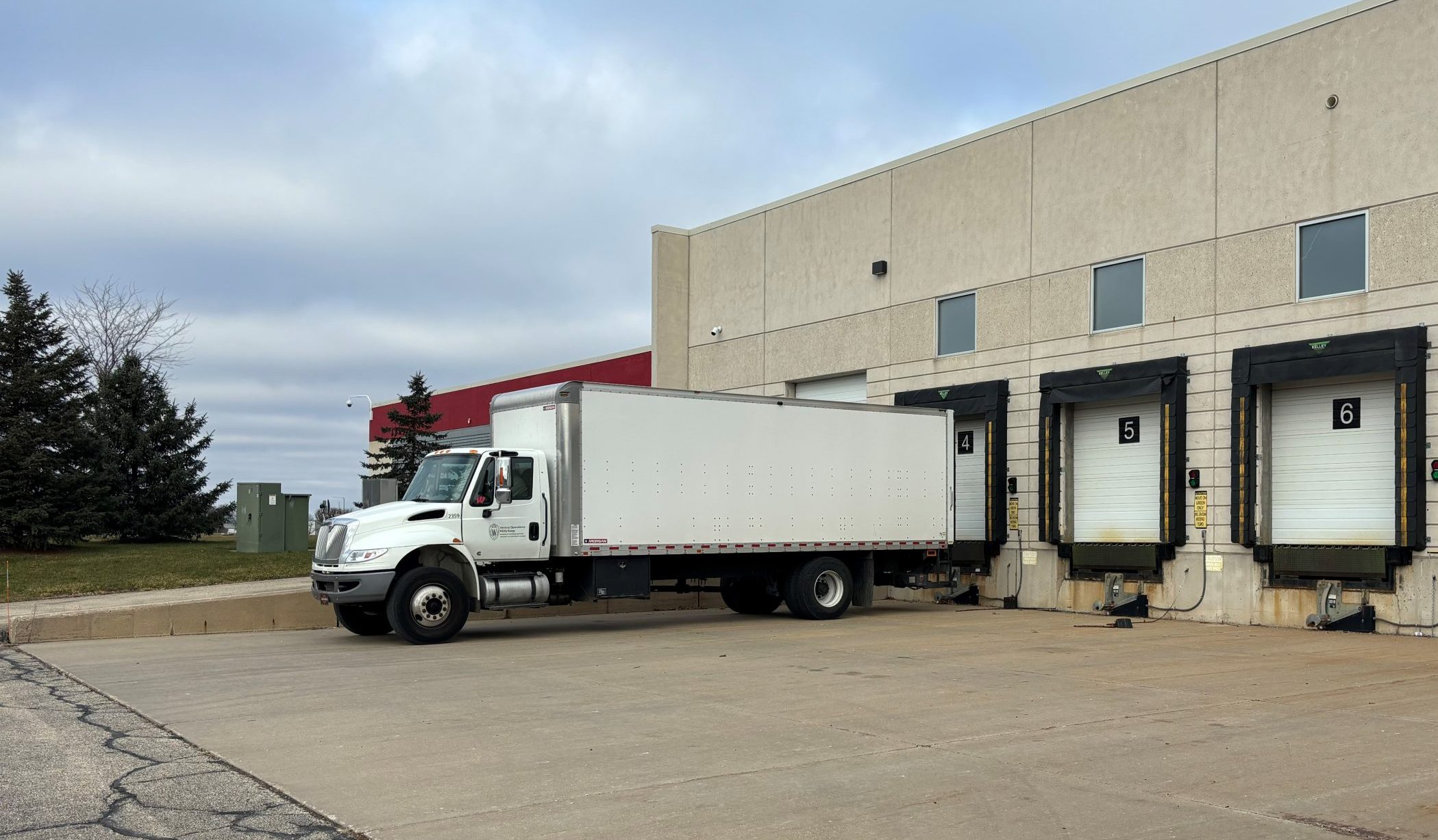A large white box truck in backed up to one of the various receiving/loading docks at Verona Operations.